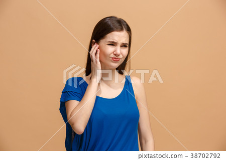 The Ear ache. The sad woman with headache or pain The Ear ache. The sad woman with headache or pain 38702792