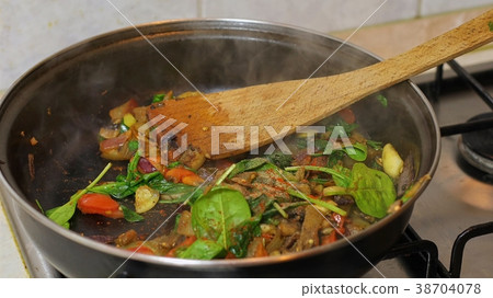 Preparing hot breakfast 38704078