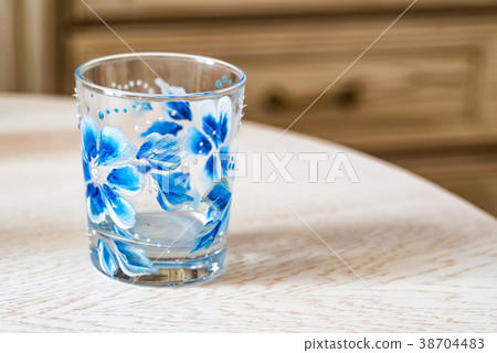 Glass with colorful floral hand painting Glass with colorful floral hand painting 38704483