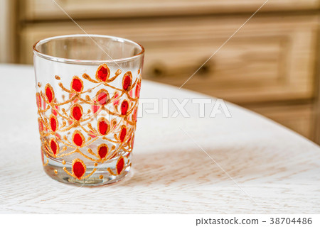 Glass with colorful hand painting Glass with colorful hand painting 38704486