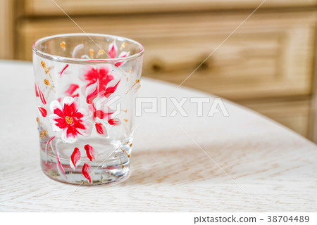 Glass with colorful floral hand painting Glass with colorful floral hand painting 38704489