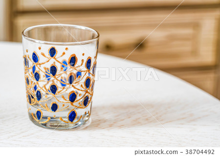 Glass with colorful hand painting Glass with colorful hand painting 38704492