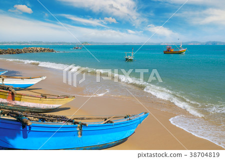 Fishing boat on the sandy shore 38704819