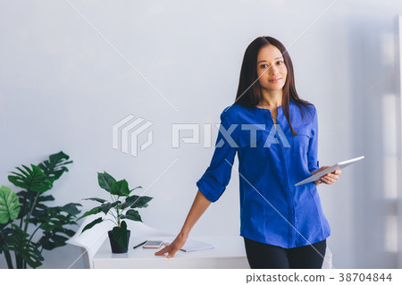 woman office worker, with tablet woman office worker, with tablet 38704844