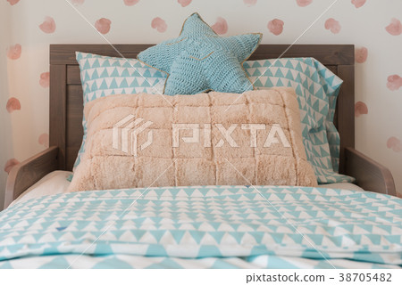 kid's bedroom with cozy bed and set of pillows 38705482