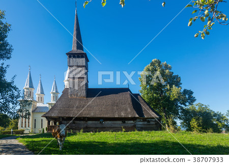 Wooden and new church in Remetea Chioarului, Romania Wooden and new church in Remetea Chioarului, Romania 38707933