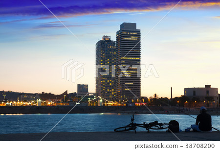 Barceloneta beach with skyscrapers in sunset Barceloneta beach with skyscrapers in sunset 38708200