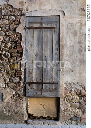 Old stone wall with wooden shutters Old stone wall with wooden shutters 38708265