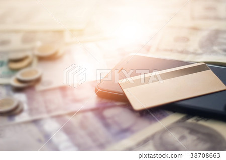 Credit card,smartphone on banknote,online shopping Credit card,smartphone on banknote,online shopping 38708663