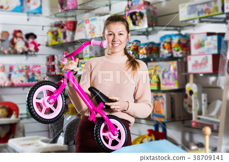 buyer choosing sport toy run bicycle 38709141