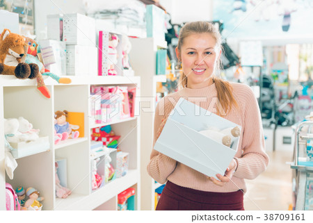 female buyer with soft toy 38709161