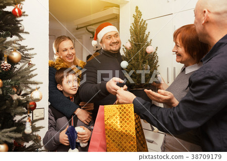 Family gathering for Christmas celebration 38709179