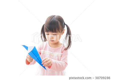 Child flying a paper plane _ travel image 38709286