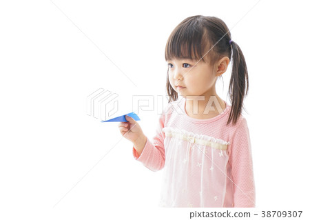 Child flying a paper plane _ travel image 38709307