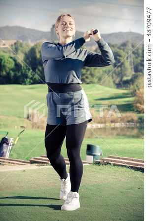 Female golfer at golf course 38709477