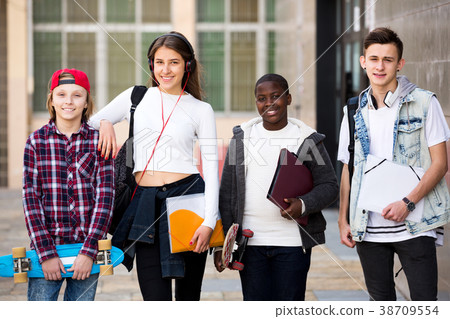 Group of teens posing outside school Group of teens posing outside school 38709554