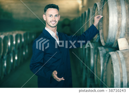man worker wearing uniform standing and writing label to woods man worker wearing uniform standing and writing label to woods 38710243