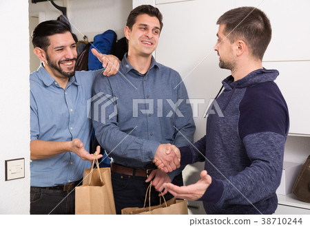 Three men getting for bachelor gatherings at home Three men getting for bachelor gatherings at home 38710244