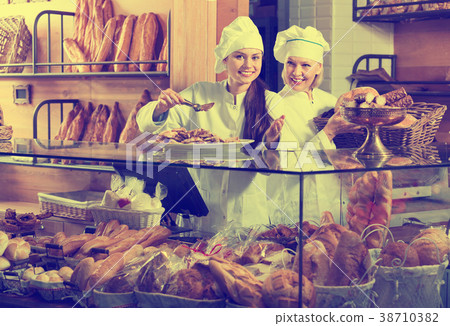 Portrait of positive women at bakery display Portrait of positive women at bakery display 38710382