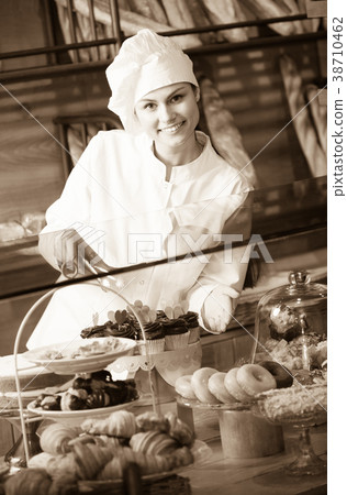 Young shopgirl posing with chocolate 38710462
