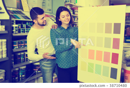 Couple in paint supplies store Couple in paint supplies store 38710480