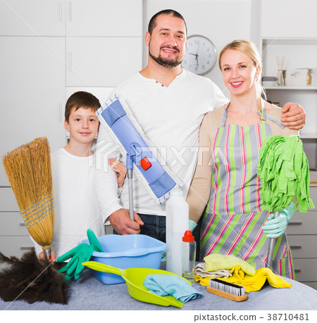 Smiling family standing, ready to cleaning Smiling family standing, ready to cleaning 38710481