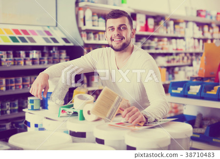 Male customer purchasing tools for house improvements 38710483