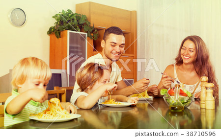 happy family of four having lunch happy family of four having lunch 38710596