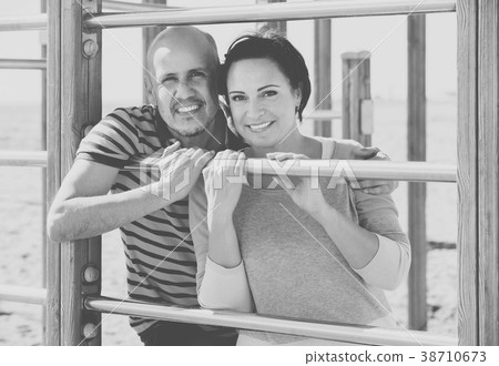 portrait of mature couple holding each other outdoors portrait of mature couple holding each other outdoors 38710673