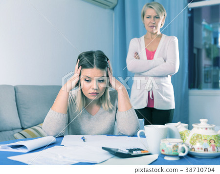 Mother scolds her adult daughter Mother scolds her adult daughter 38710704