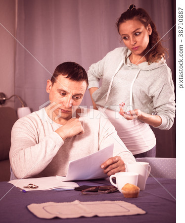 Husband and pregnant wife arguing at home Husband and pregnant wife arguing at home 38710887