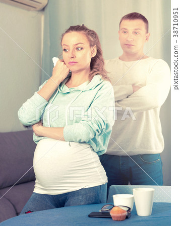 Husband and pregnant wife arguing at home Husband and pregnant wife arguing at home 38710951