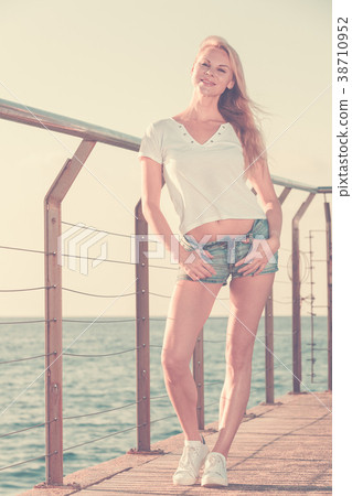 Beautiful female is posing on pirce Beautiful female is posing on pirce 38710952
