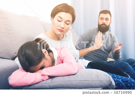 Father lecturing wife and daughter 38710990