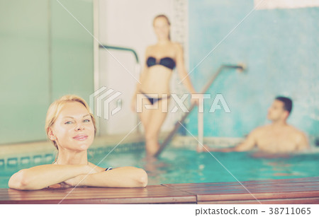Female in pool in spa salon Female in pool in spa salon 38711065