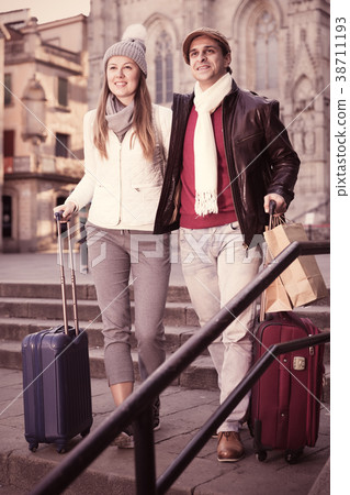 Man and woman with bags in autumn Man and woman with bags in autumn 38711193