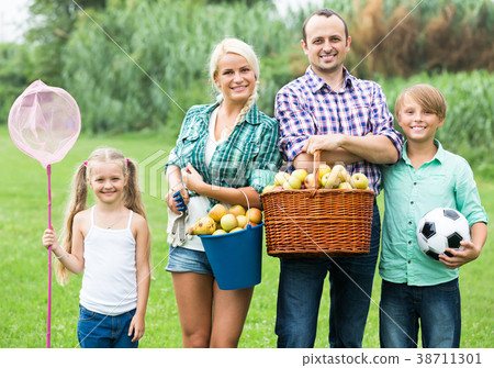 Parents with two children at the lawn 38711301