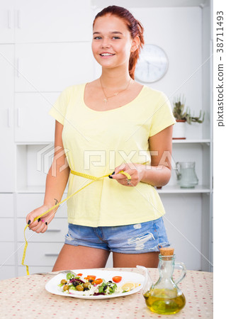 smiling girl measuring tape 38711493