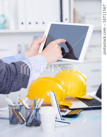 Hands of businesswoman using tablet 38711567