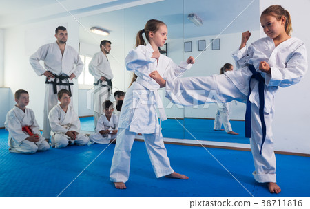 Girls training during karate class 38711816
