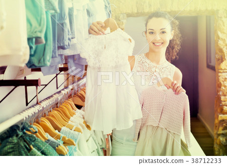 Woman shopping baby dress 38712233