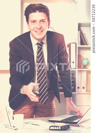 Man office worker in black suit Man office worker in black suit 38712236