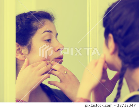 Girl cleaning pores 38712347