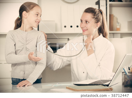 Portrait of little child with young medical worker Portrait of little child with young medical worker 38712447