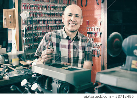 Professional key cutter making door keys copies 38712496