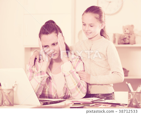 Irritated mother watching at the mistakes Irritated mother watching at the mistakes 38712533