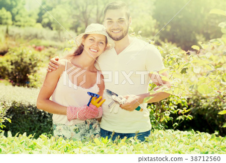 Young couple gardening together . 38712560