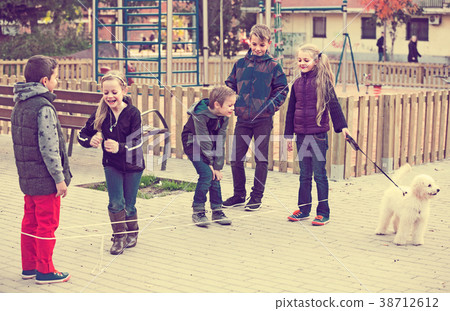 children playing rubber band children playing rubber band 38712612