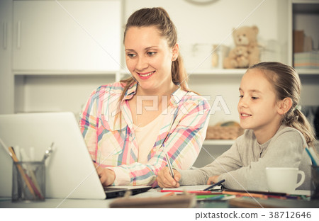 Smiling schoolgirl and young mother Smiling schoolgirl and young mother 38712646