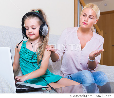 daughter using laptop instead of studying daughter using laptop instead of studying 38712656